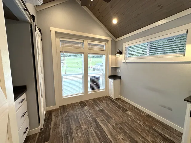 a kitchen with stainless steel appliances kitchen island granite countertop a stove a sink and a microwave