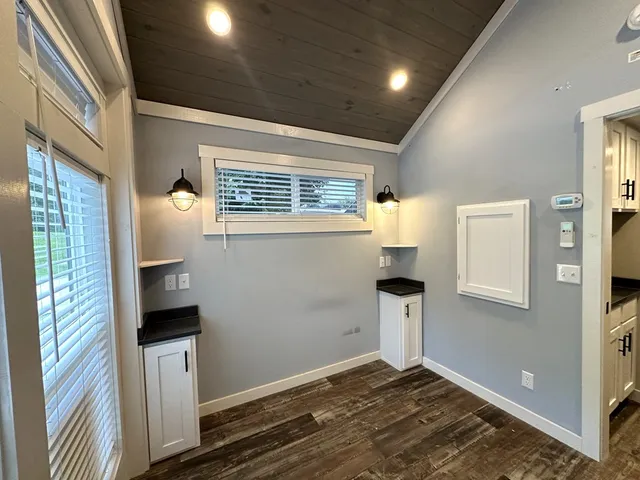 a kitchen with stainless steel appliances granite countertop a stove microwave and cabinets