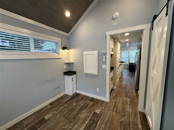 a view of house with backyard outdoor seating and green space