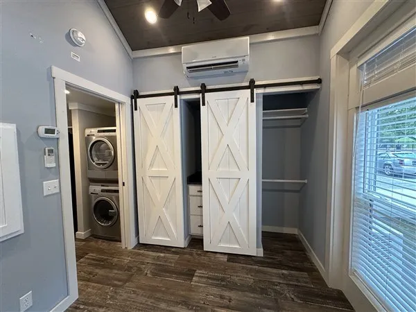 a front view of a house with a garden and porch