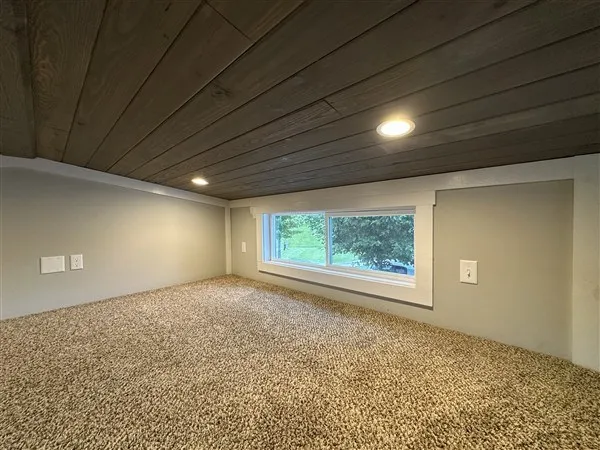 a front view of a house with a yard table and chairs