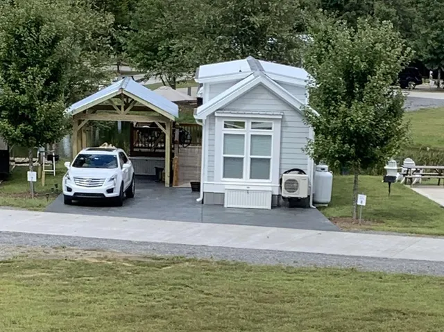 a kitchen with stainless steel appliances granite countertop a stove a microwave and a sink