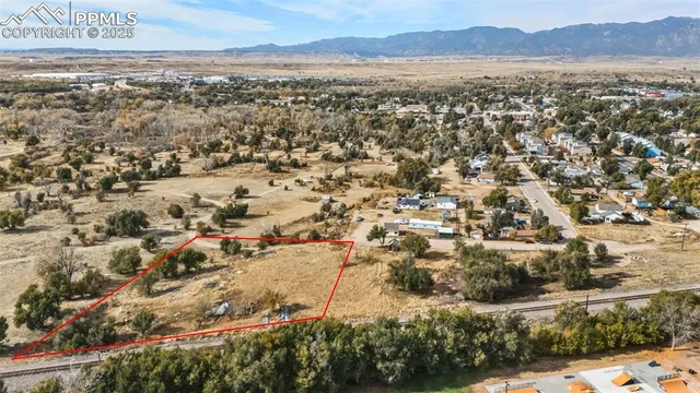 an aerial view of residential house and green space