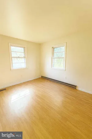an empty room with a empty space and a window