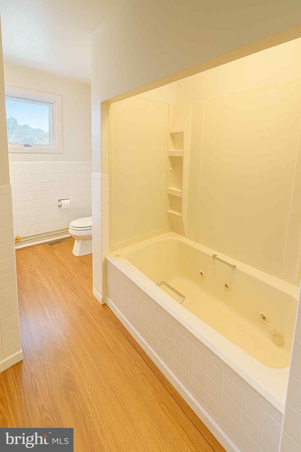 1536 West Trindle Road Carlisle, PA 17015 - Photo 8 of 15 a bathroom with a bathtub and a toilet