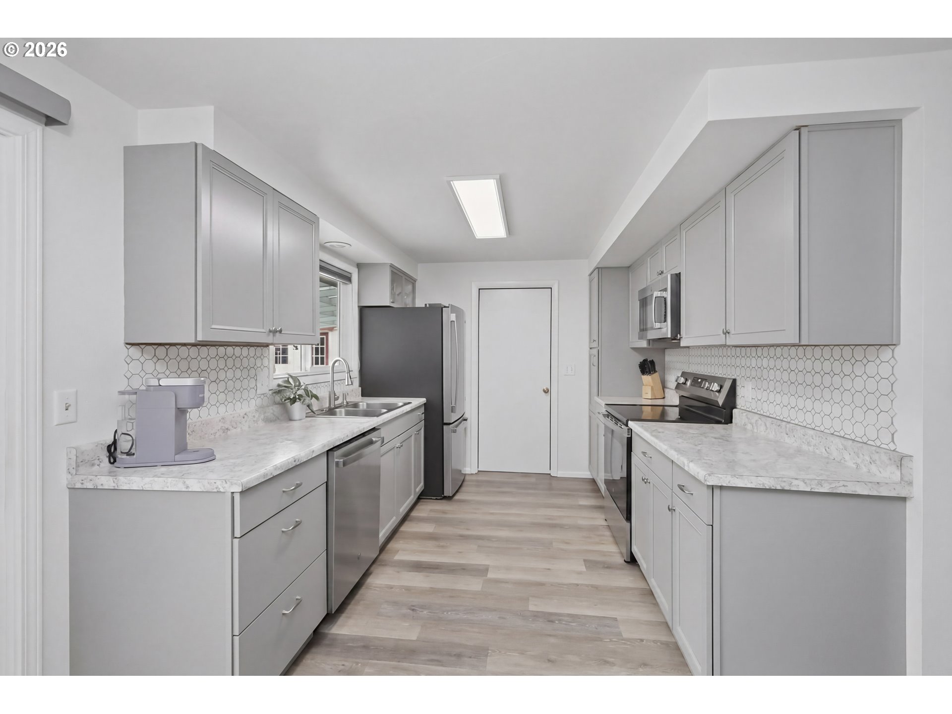 1125 Delrose Drive Springfield, OR 97477 - Photo 11 of 35 a kitchen with a sink stove and refrigerator