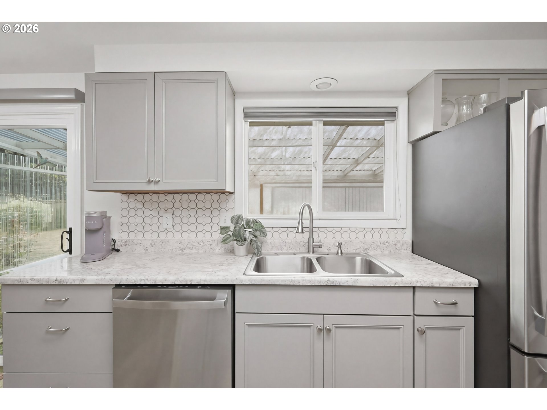 1125 Delrose Drive Springfield, OR 97477 - Photo 12 of 35 a kitchen with a sink cabinets and window