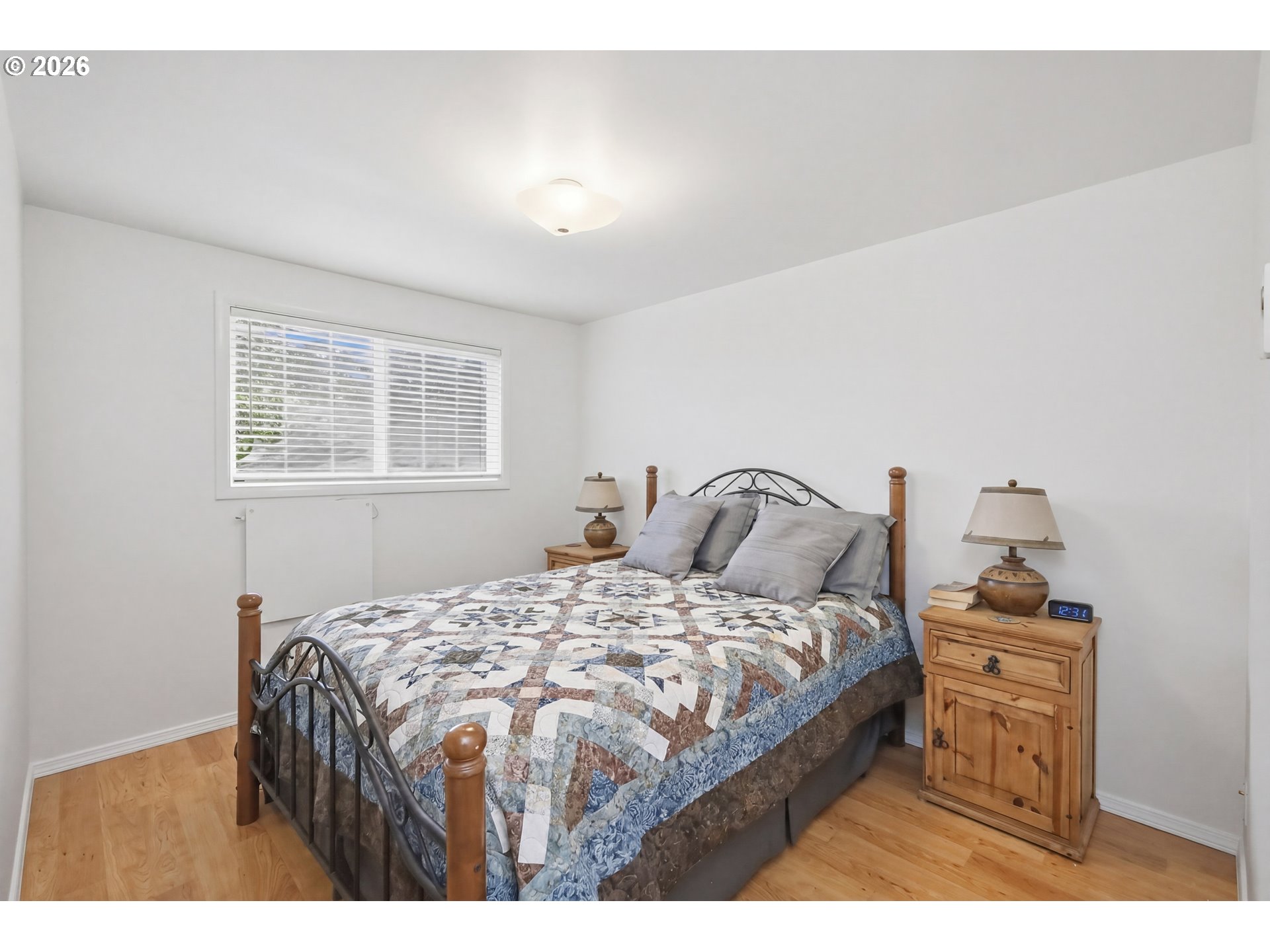 1125 Delrose Drive Springfield, OR 97477 - Photo 22 of 35 a bedroom with a bed a mirror and dresser