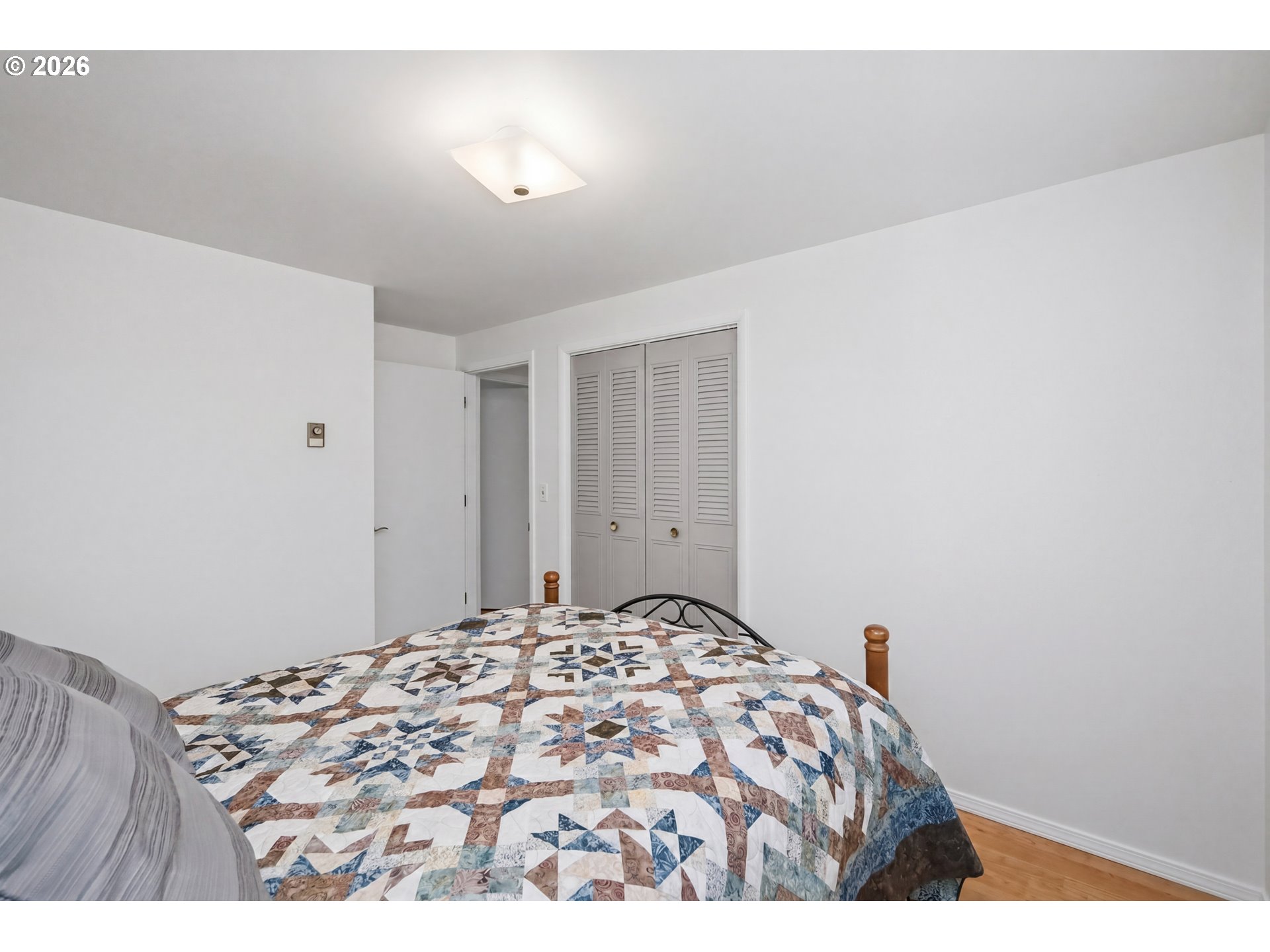 1125 Delrose Drive Springfield, OR 97477 - Photo 23 of 35 a bedroom with a bed and a window