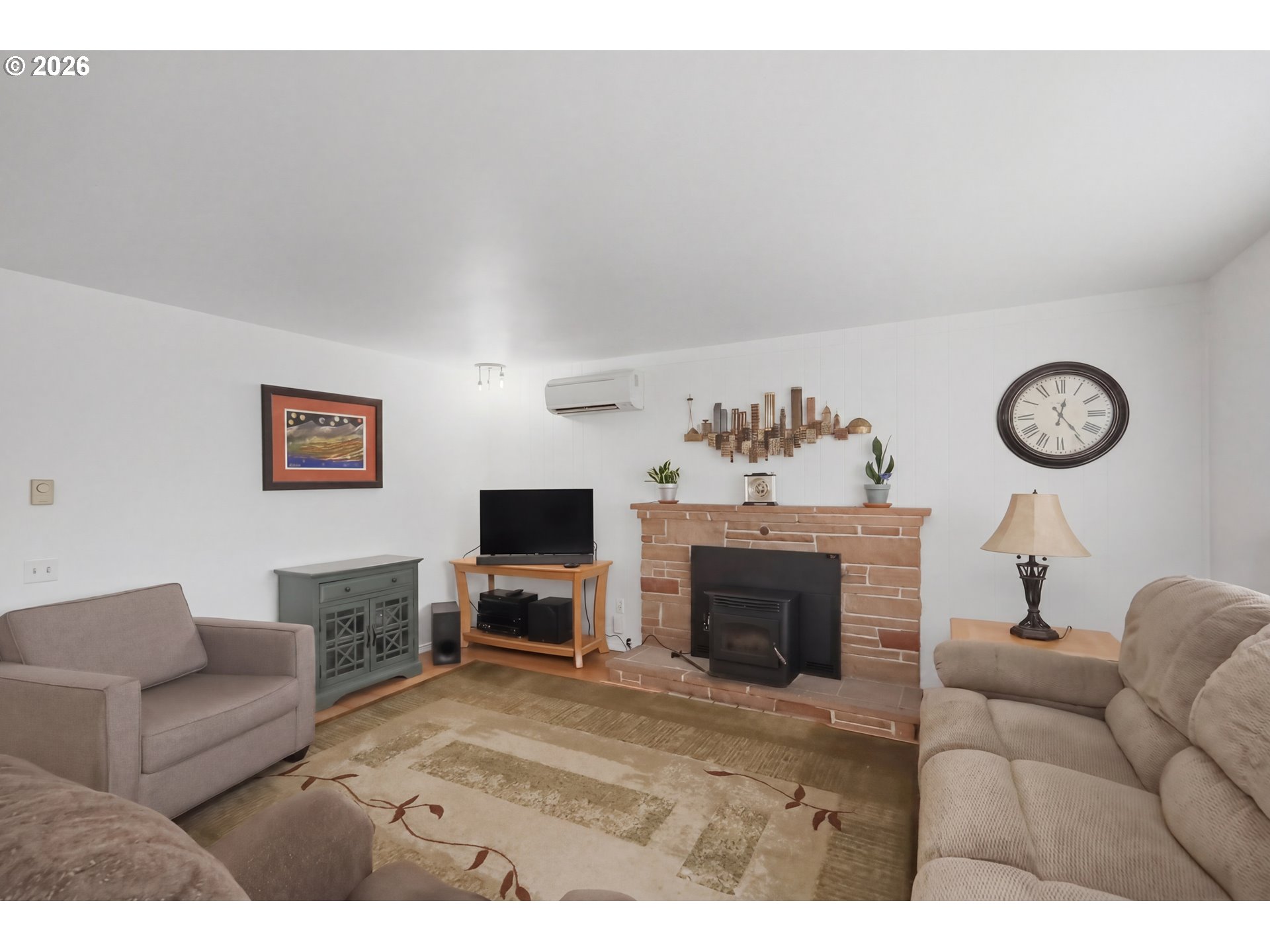 1125 Delrose Drive Springfield, OR 97477 - Photo 6 of 35 a living room with furniture a fireplace and a flat screen tv