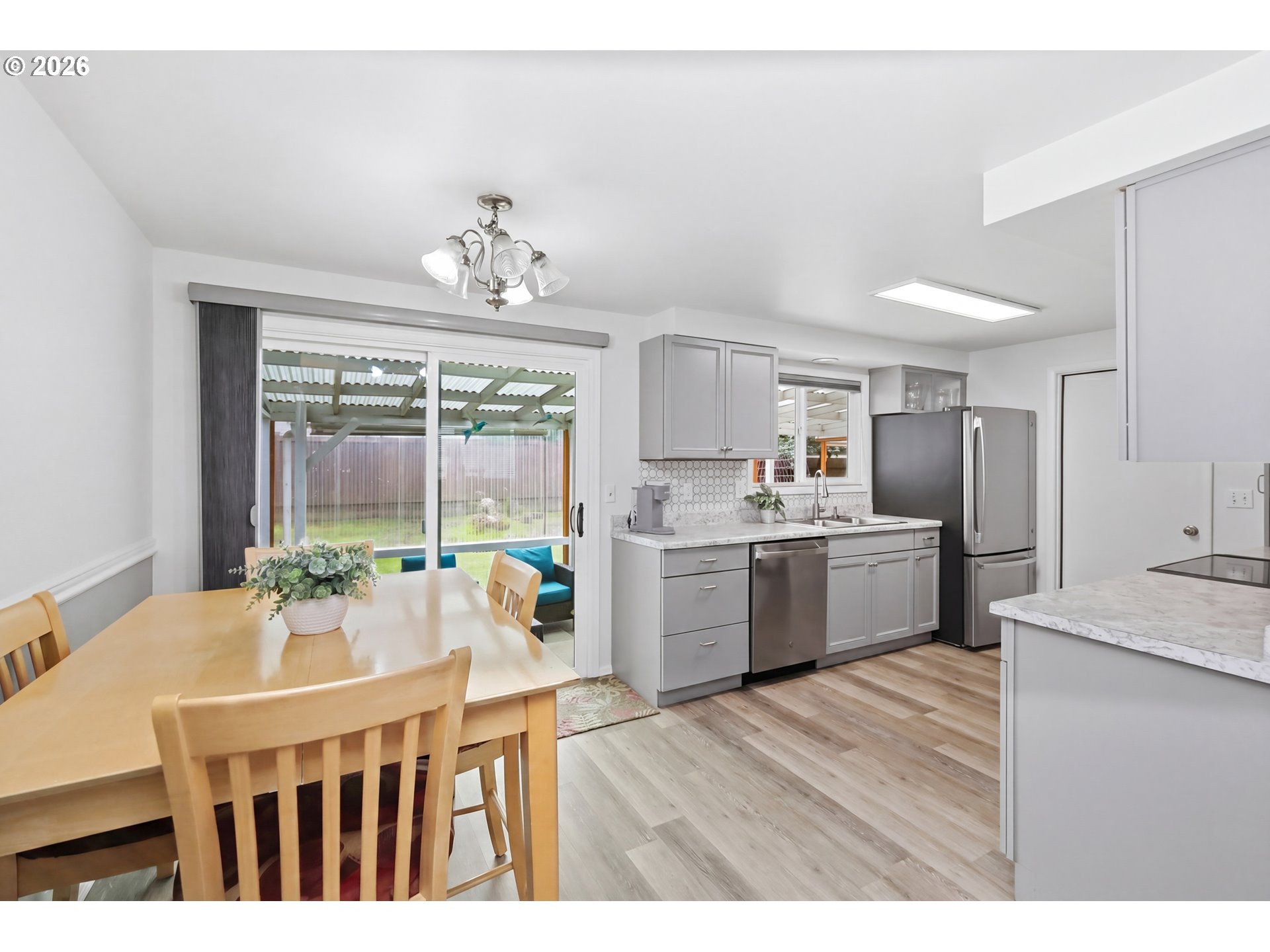 1125 Delrose Drive Springfield, OR 97477 - Photo 10 of 35 a kitchen with a table chairs sink and cabinets