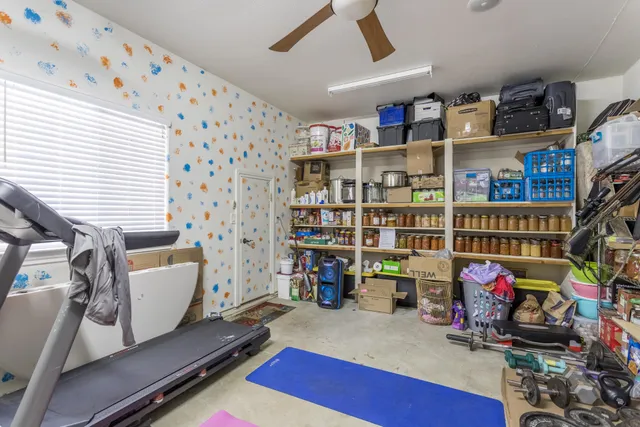 a room with furniture and a book shelf