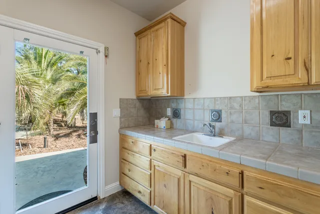 a kitchen with stainless steel appliances white cabinets and a granite counter tops