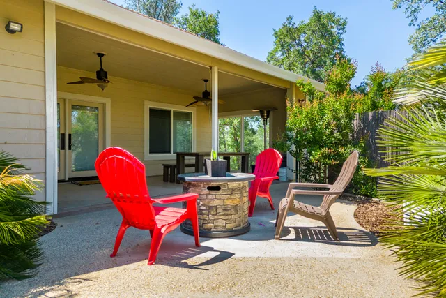 a view of a two chairs in the patio