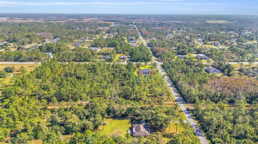 Quinlan Street Orlando, FL 32833 - Photo 30 of 40 an aerial view of residential houses with outdoor space and trees