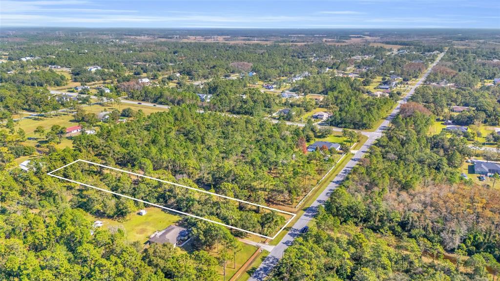 Quinlan Street Orlando, FL 32833 - Photo 31 of 40 an aerial view of residential houses with outdoor space and trees