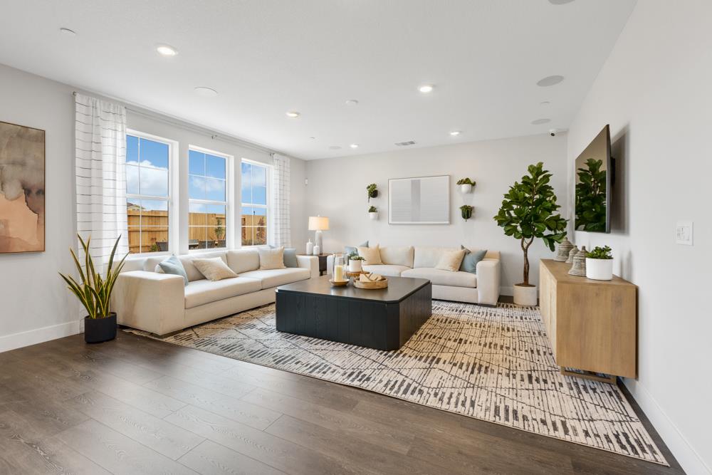 8435 Kyler Road Elk Grove, CA 95757 - Photo 12 of 56 a living room with furniture and a large window