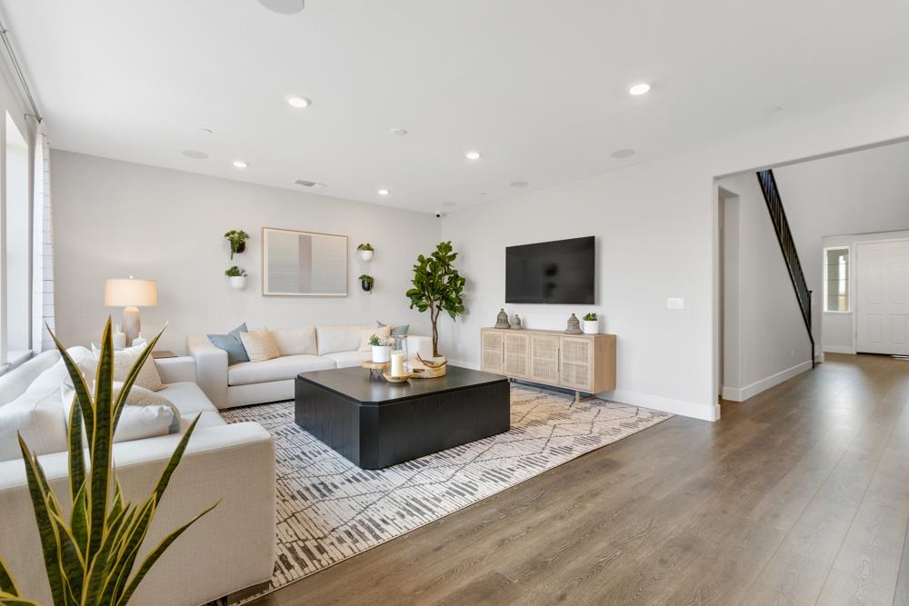 8435 Kyler Road Elk Grove, CA 95757 - Photo 13 of 56 a living room with fireplace furniture and a flat screen tv