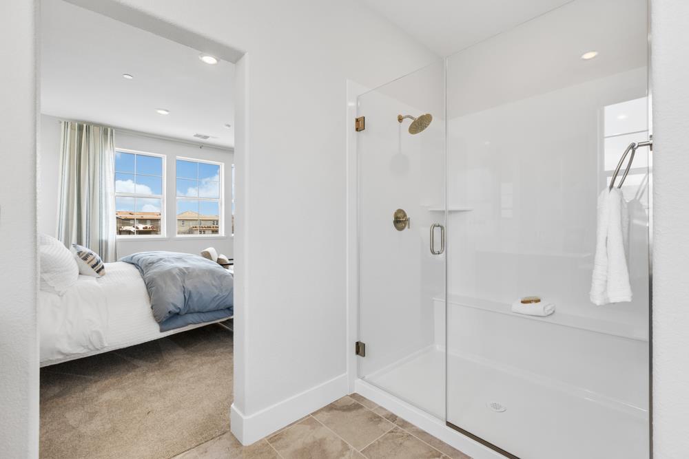 8435 Kyler Road Elk Grove, CA 95757 - Photo 19 of 56 a room with a bed and a view of bathroom