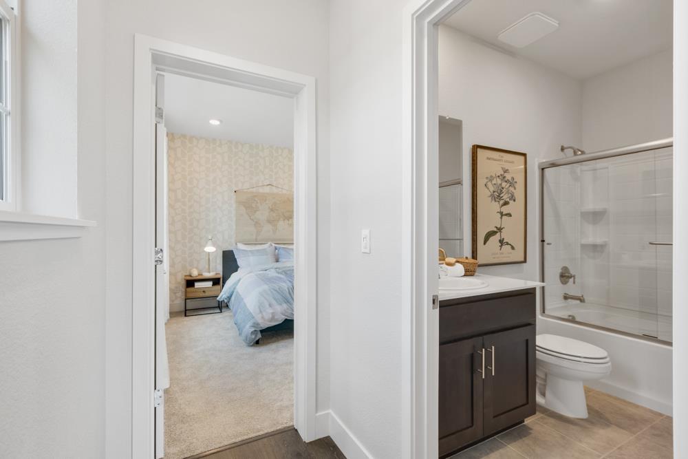 8435 Kyler Road Elk Grove, CA 95757 - Photo 23 of 56 a en suite bathroom with a sink toilet and shower