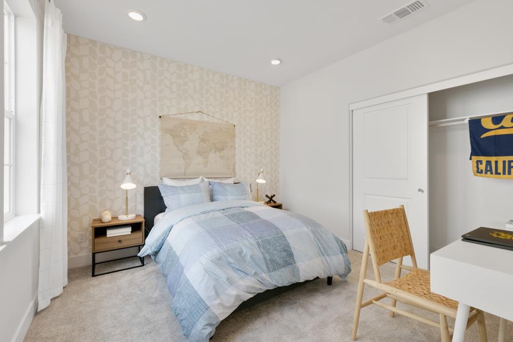 8435 Kyler Road Elk Grove, CA 95757 - Photo 25 of 56 a bedroom with a bed and a chair