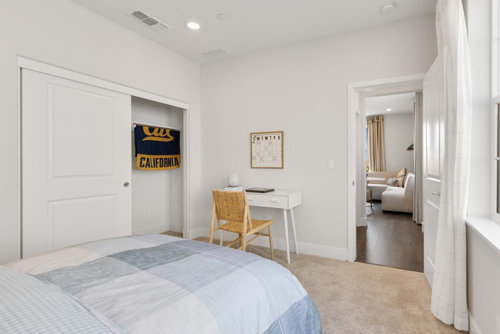 8435 Kyler Road Elk Grove, CA 95757 - Photo 26 of 56 a bedroom with a bed and a chair