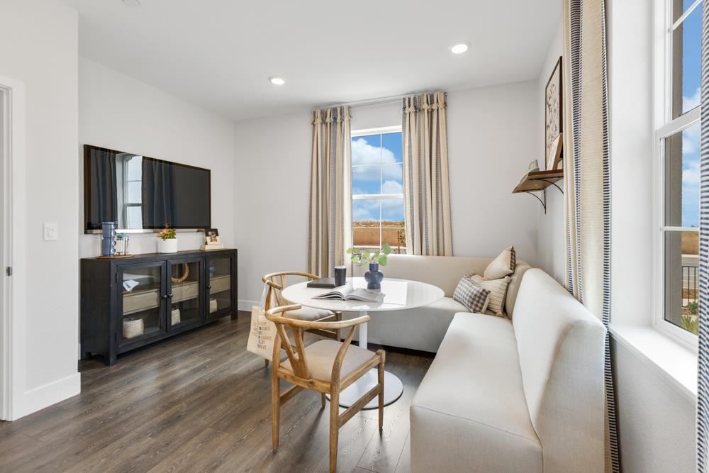 8435 Kyler Road Elk Grove, CA 95757 - Photo 27 of 56 a living room with furniture and a flat screen tv