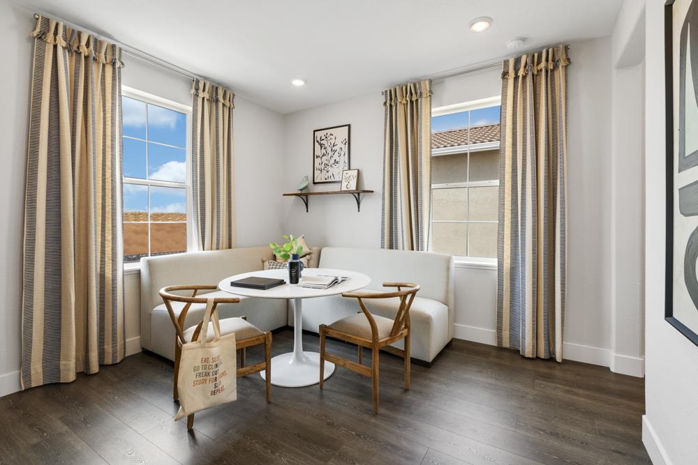 8435 Kyler Road Elk Grove, CA 95757 - Photo 28 of 56 a view of a dining room with furniture and wooden floor