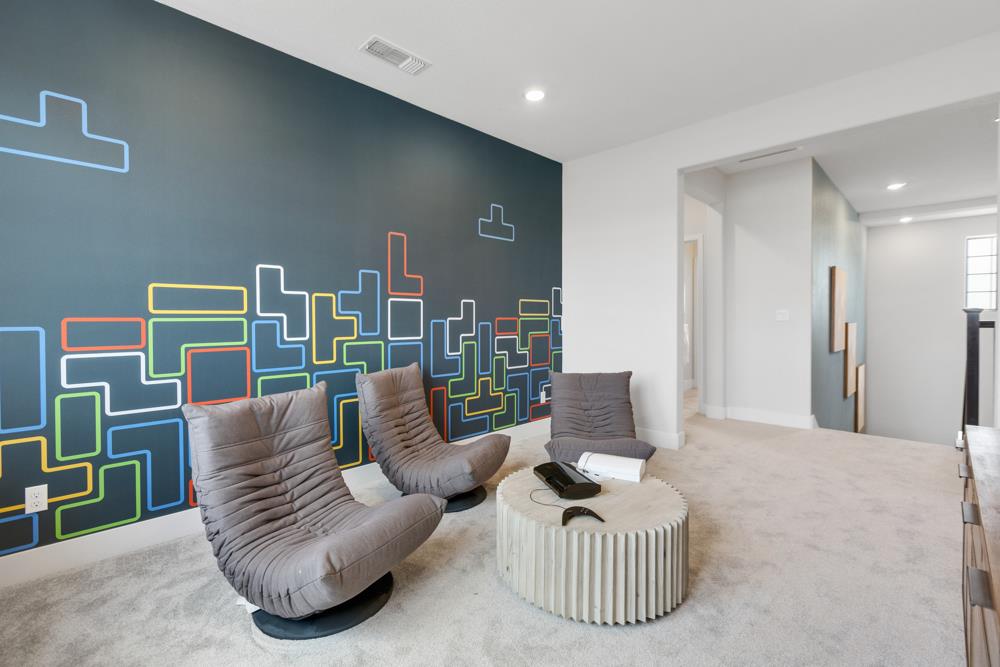 8435 Kyler Road Elk Grove, CA 95757 - Photo 38 of 56 a living room with furniture and a wooden floor