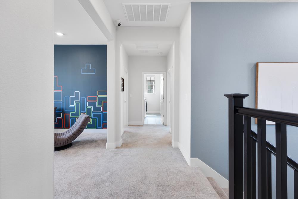 8435 Kyler Road Elk Grove, CA 95757 - Photo 39 of 56 a view of a hallway with an entryway and livingroom