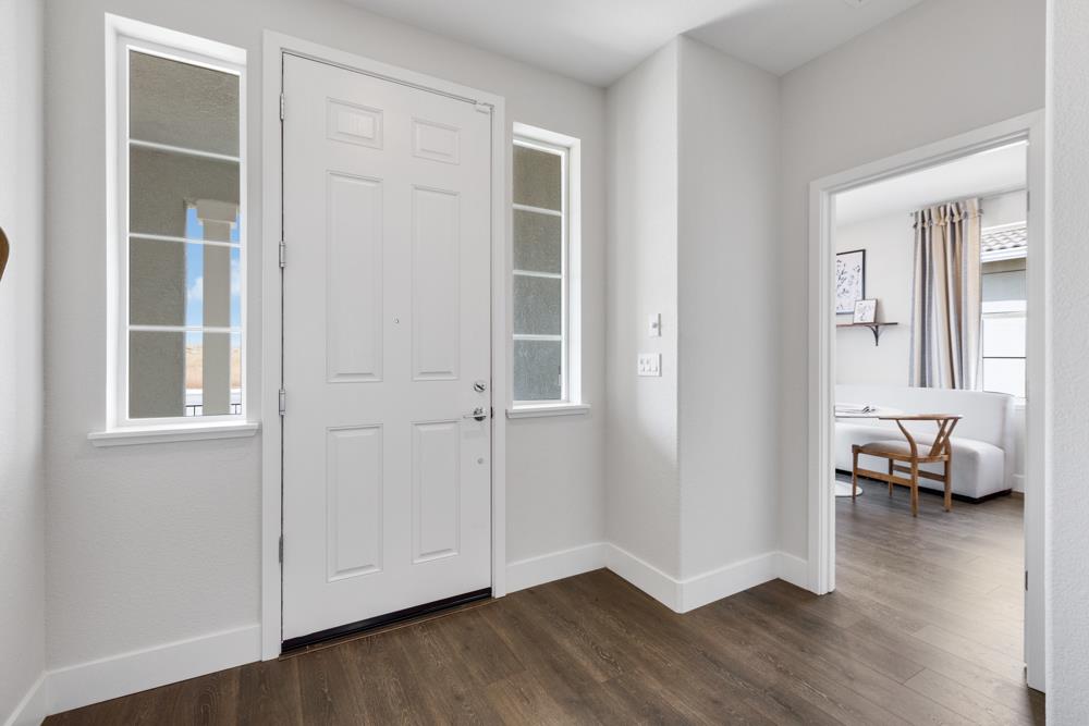 8435 Kyler Road Elk Grove, CA 95757 - Photo 44 of 56 a view of livingroom with hardwood floor and window