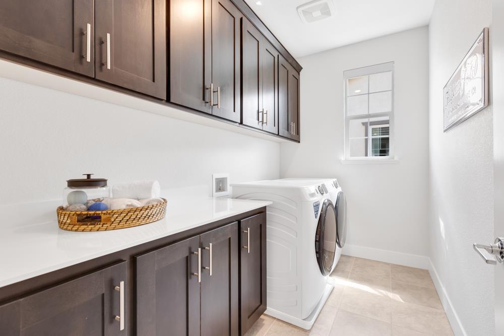 8435 Kyler Road Elk Grove, CA 95757 - Photo 47 of 56 a utility room with wooden floor washer and dryer