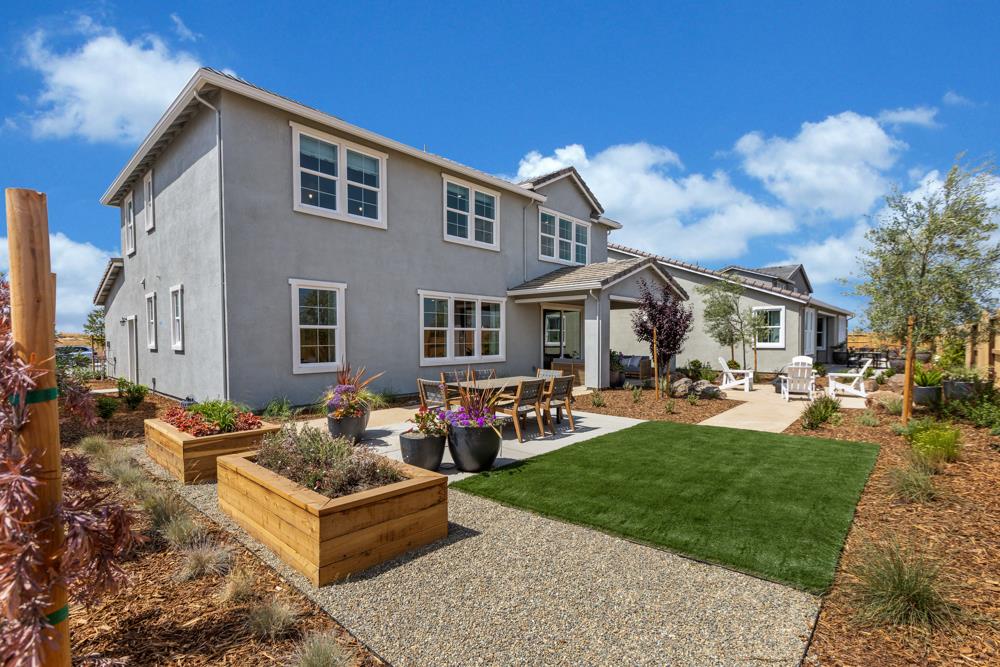 8435 Kyler Road Elk Grove, CA 95757 - Photo 50 of 56 a front view of a house with garden and porch