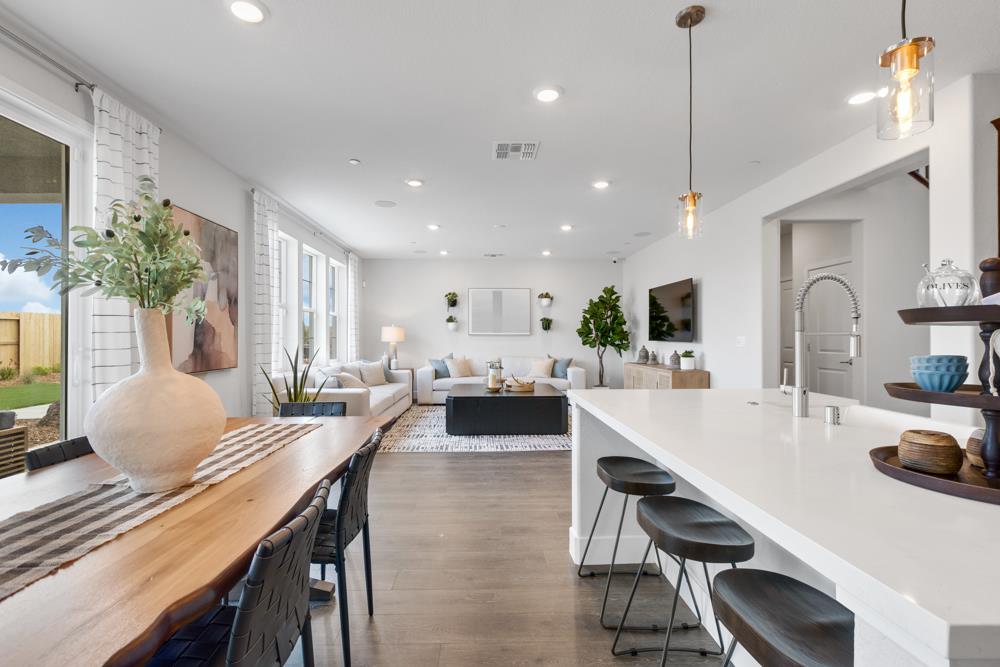 8435 Kyler Road Elk Grove, CA 95757 - Photo 10 of 56 a large kitchen with a table and chairs