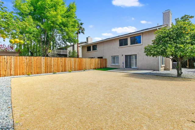 a house with swimming pool in front of it