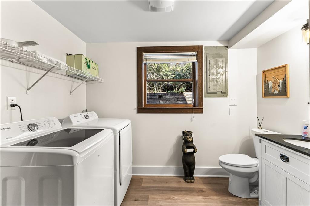 40 Kaceys Lane Helen, GA 30545 - Photo 19 of 35 a bathroom with a toilet a sink and a window