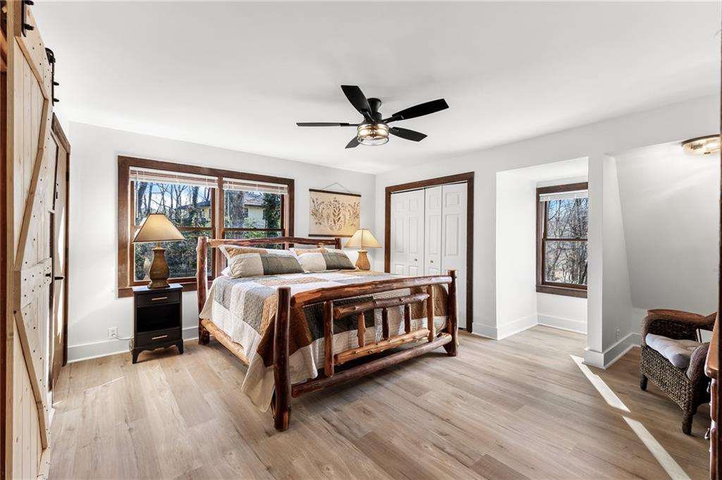40 Kaceys Lane Helen, GA 30545 - Photo 26 of 35 a bed room with a bed and a chandelier