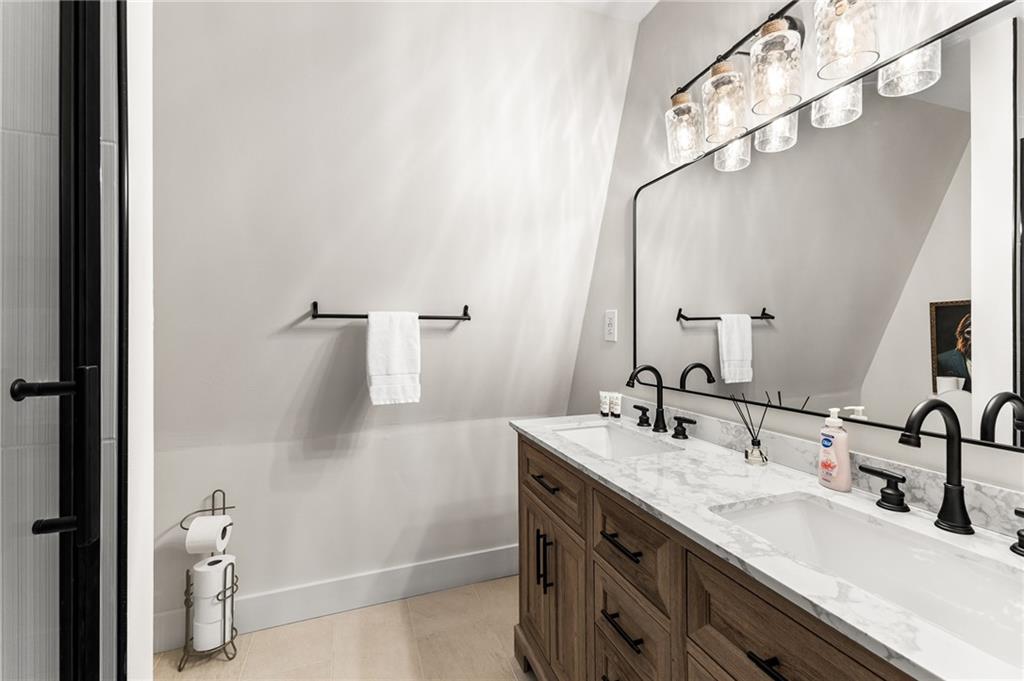 40 Kaceys Lane Helen, GA 30545 - Photo 29 of 35 a bathroom with a double vanity sink and mirror