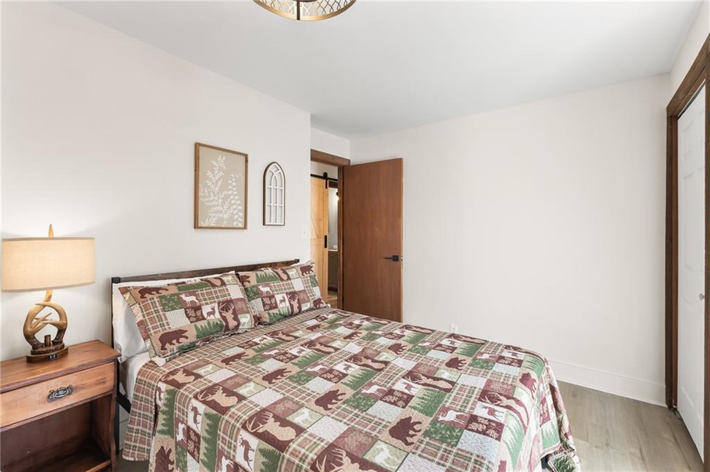 40 Kaceys Lane Helen, GA 30545 - Photo 35 of 35 a bedroom with a bed and lamp