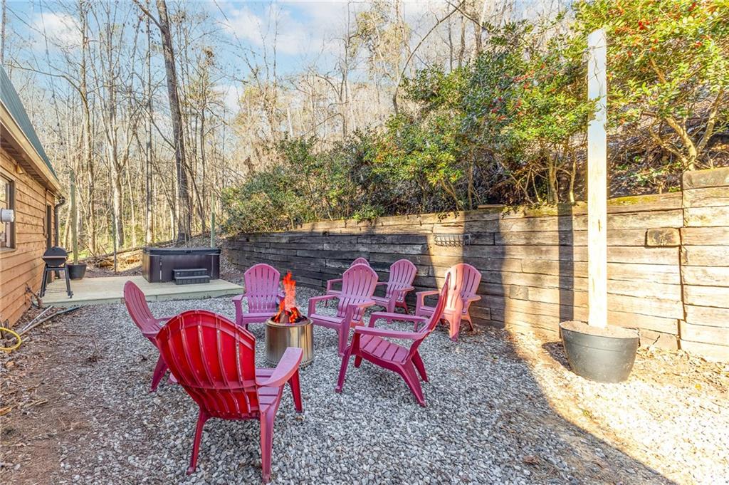 40 Kaceys Lane Helen, GA 30545 - Photo 6 of 35 a view of a chairs with a table in the patio