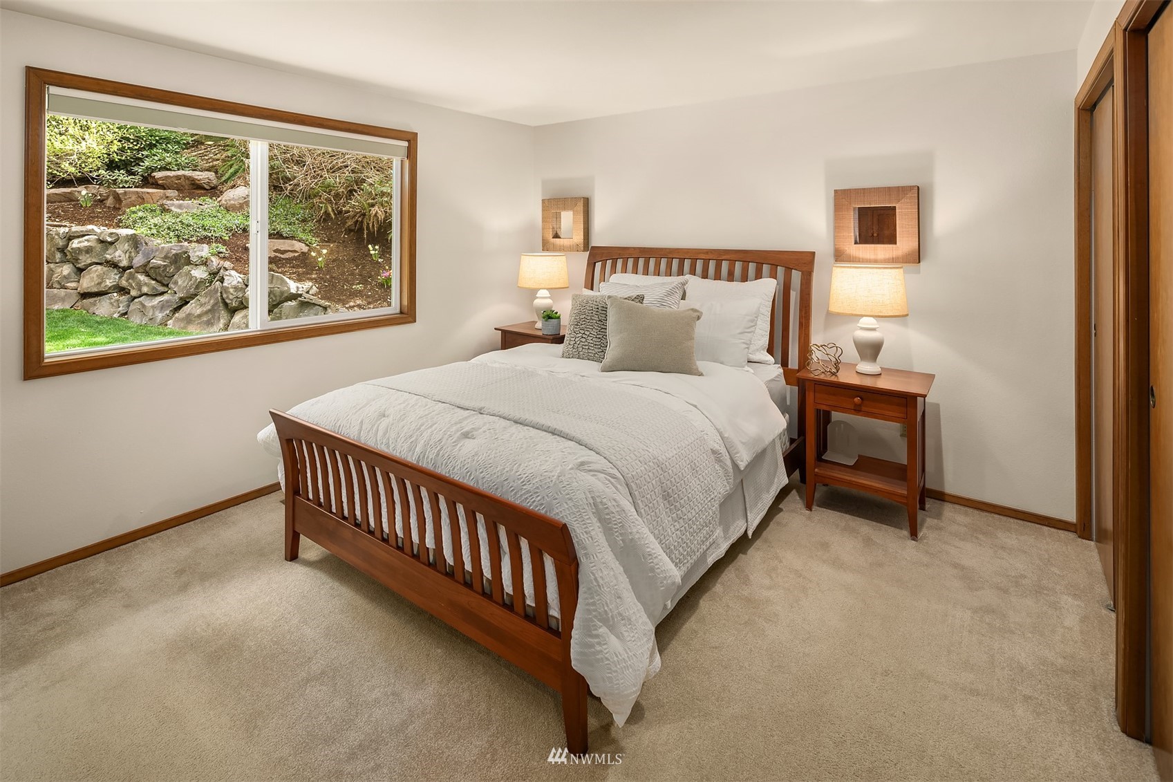 21832 Northeast 8th Street Sammamish, WA 98074 - Photo 16 of 40 a bed room with a bed and a window