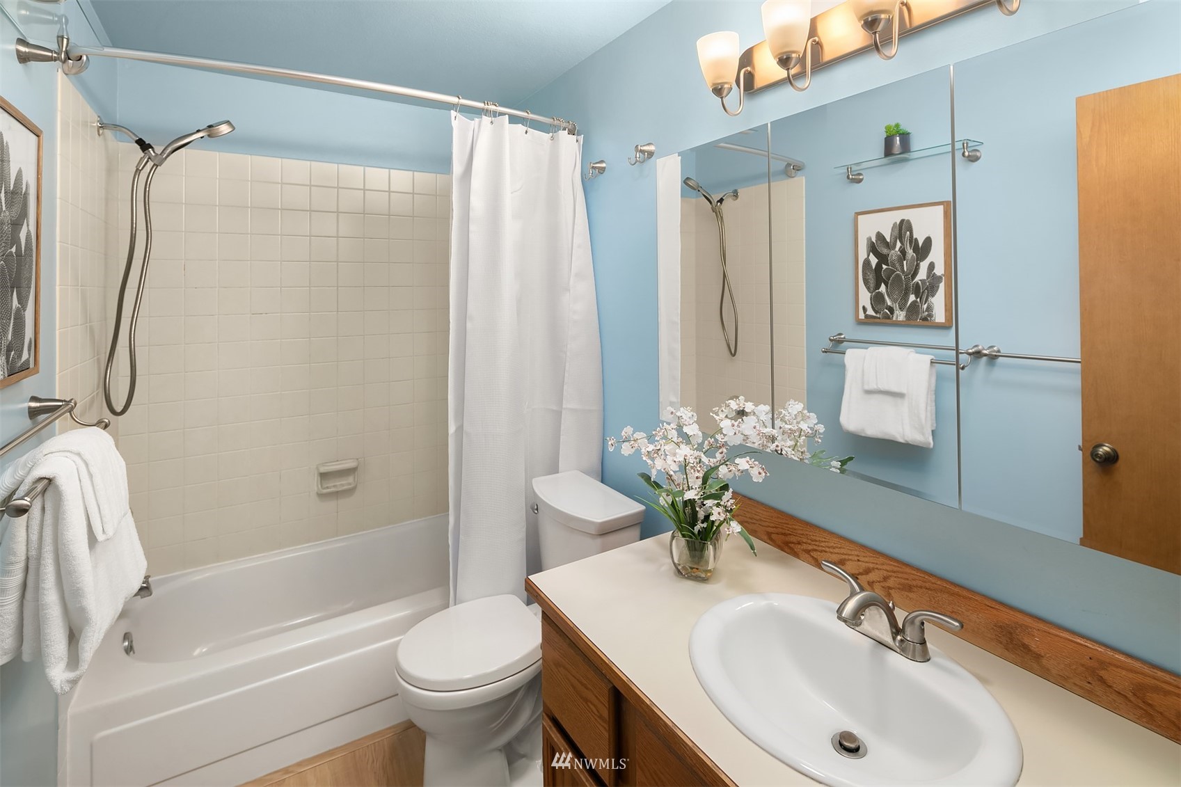 21832 Northeast 8th Street Sammamish, WA 98074 - Photo 18 of 40 a bathroom with a sink toilet and shower