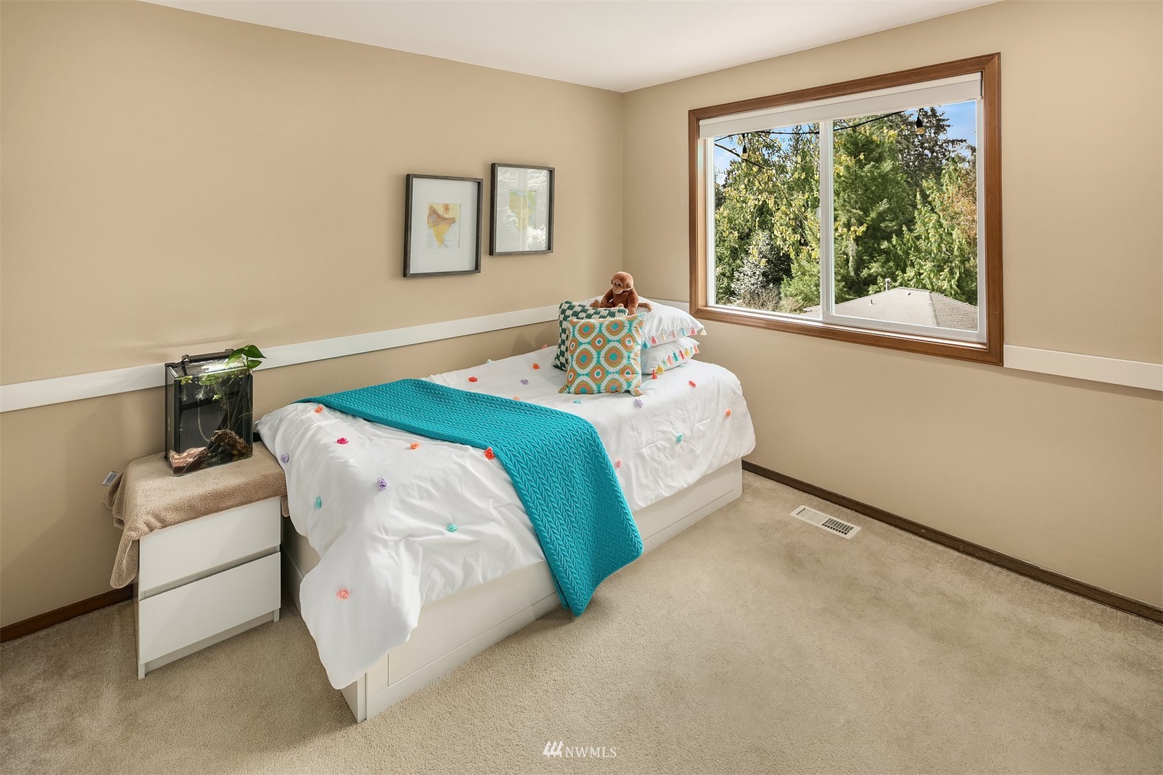 21832 Northeast 8th Street Sammamish, WA 98074 - Photo 19 of 40 a bedroom with a bed and a window