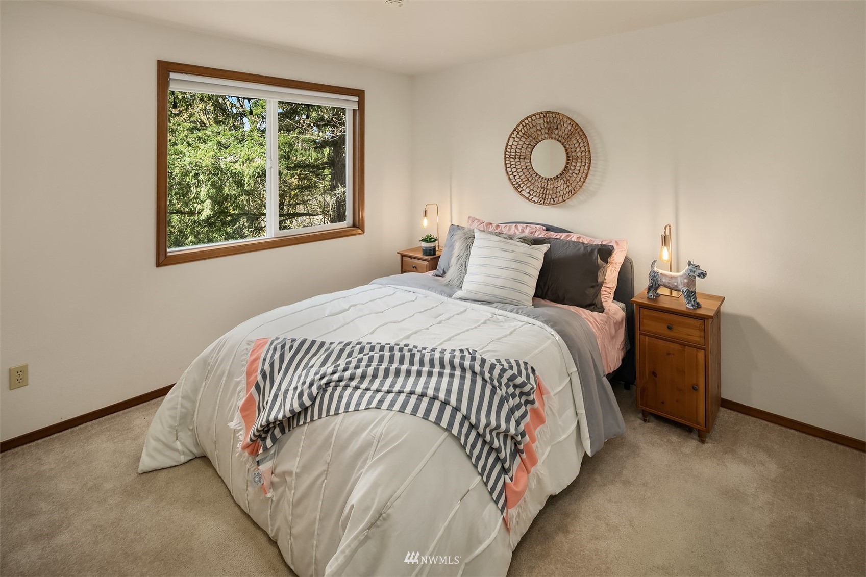 21832 Northeast 8th Street Sammamish, WA 98074 - Photo 21 of 40 a bedroom with a bed and a window