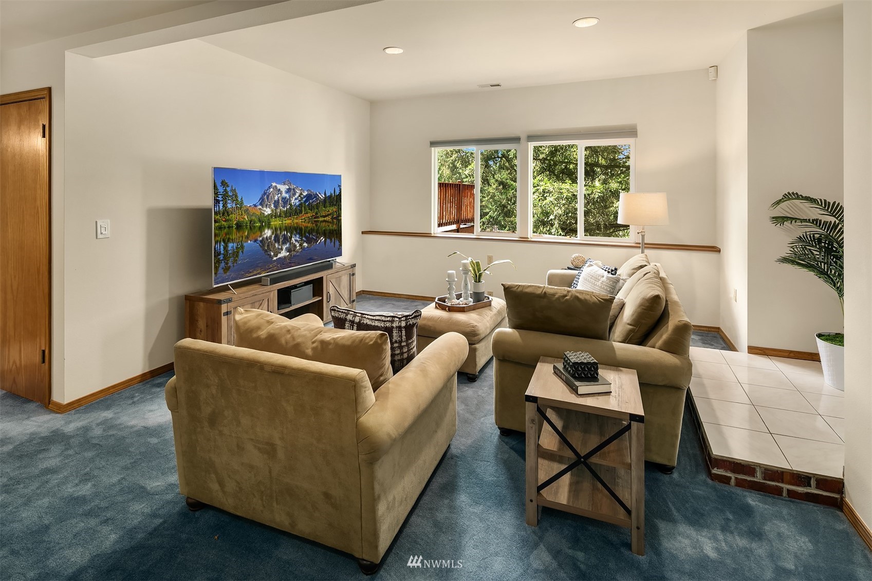 21832 Northeast 8th Street Sammamish, WA 98074 - Photo 22 of 40 a living room with furniture and a flat screen tv