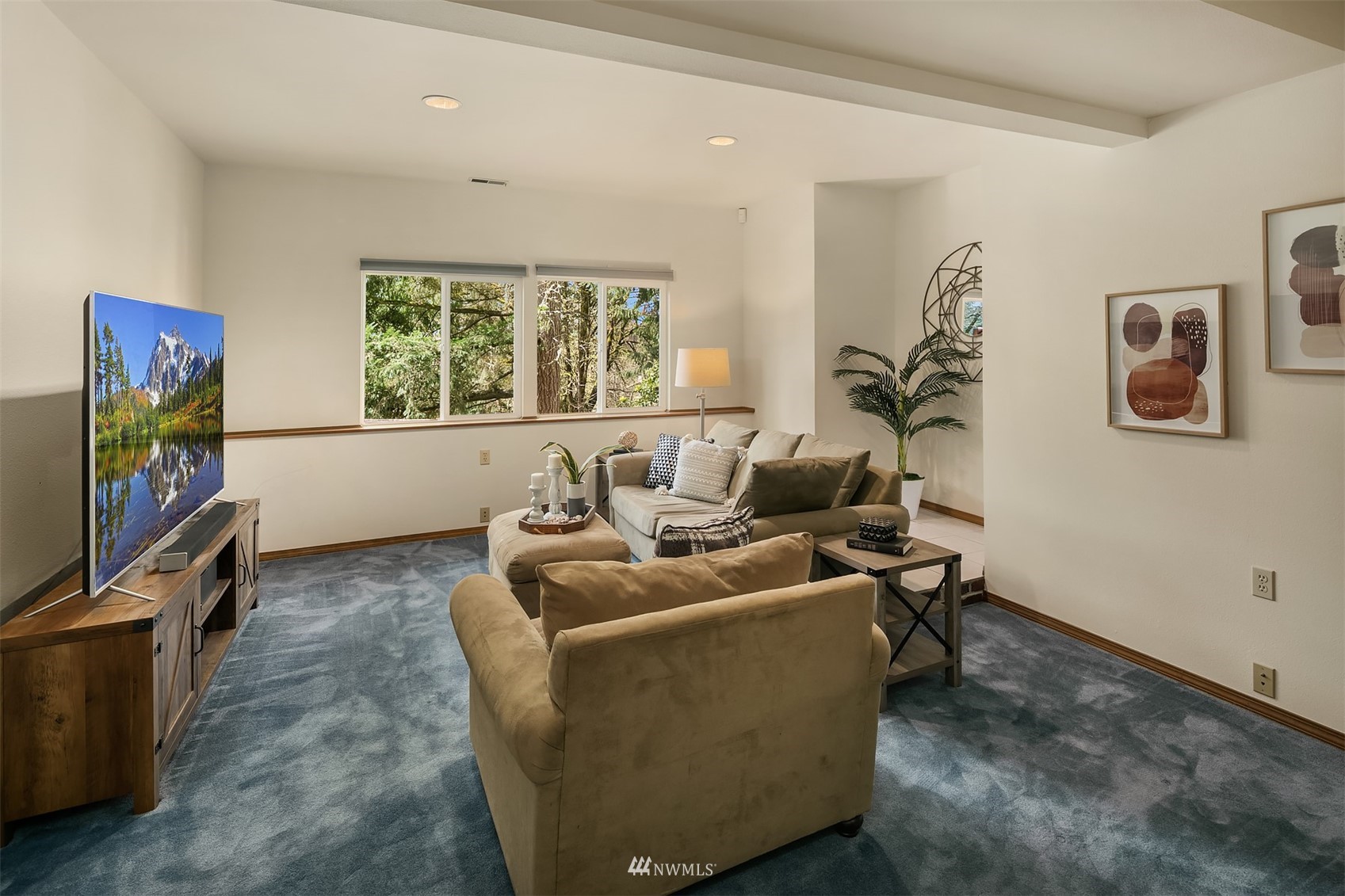 21832 Northeast 8th Street Sammamish, WA 98074 - Photo 23 of 40 a living room with furniture and a flat screen tv