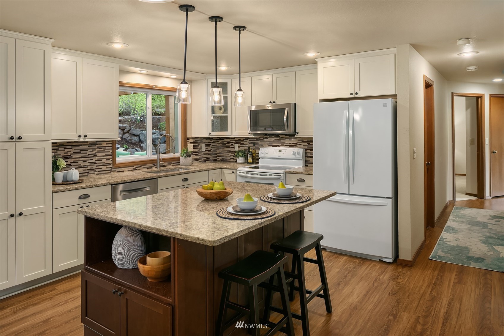 21832 Northeast 8th Street Sammamish, WA 98074 - Photo 8 of 40 a kitchen with refrigerator and chairs