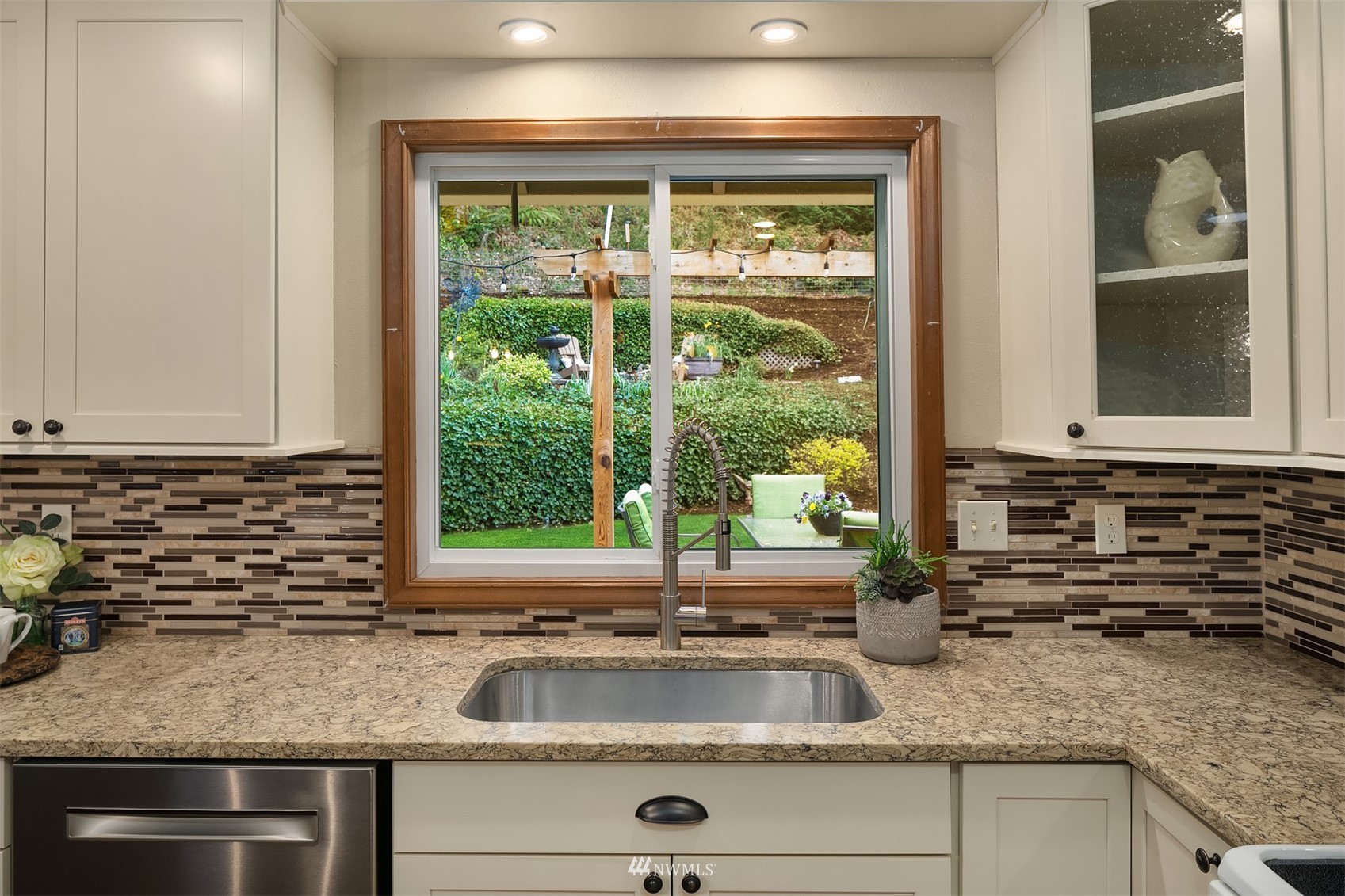 21832 Northeast 8th Street Sammamish, WA 98074 - Photo 9 of 40 a kitchen with granite countertop a sink and a window