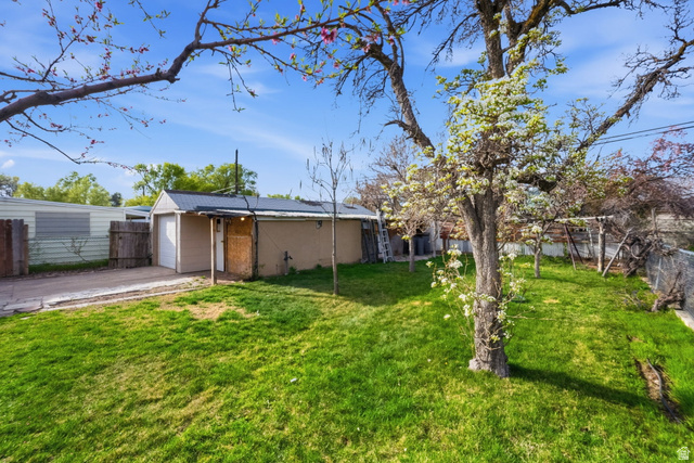 708 9th Street Ogden, UT 84404 - Photo 5 of 17 View of yard featuring a garage and driveway