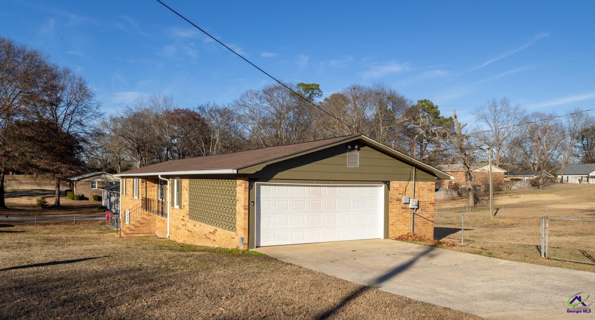 3491 Sandy Circle Macon, GA 31216 - Photo 35 of 47 a front view of a house with a yard